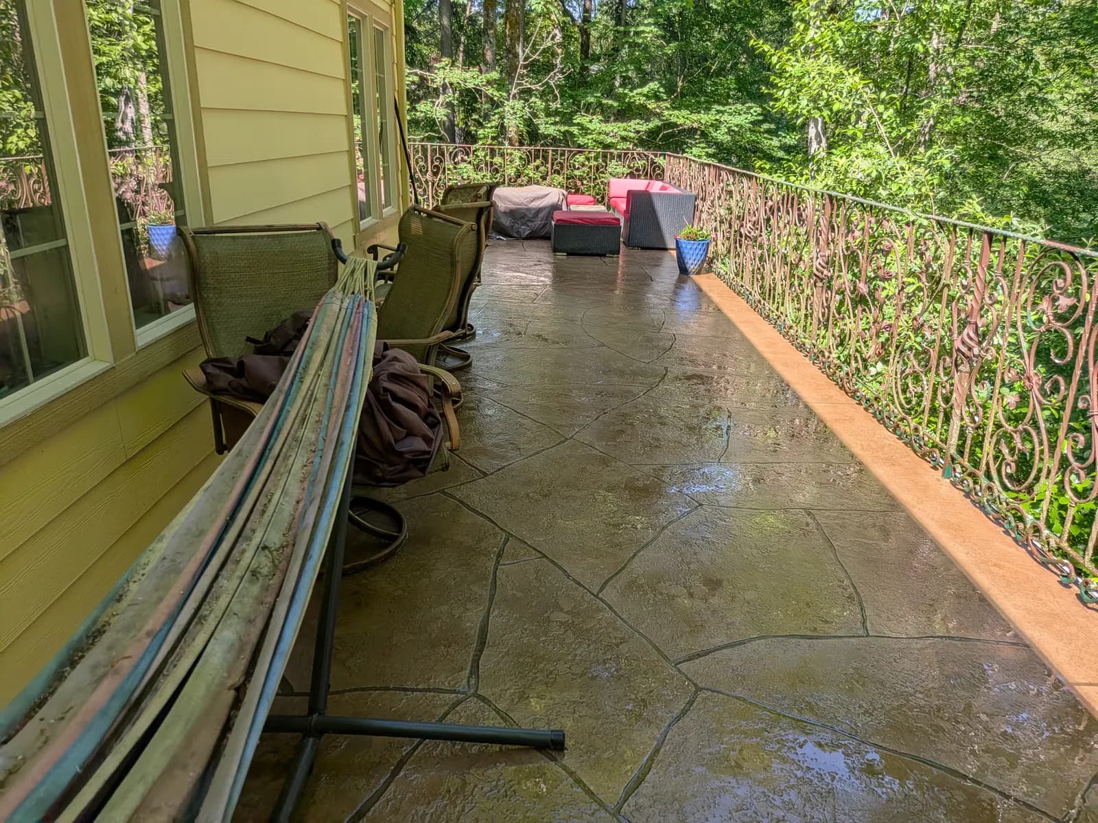 After — Grimy stamped-concrete balcony restored by pressure washing
