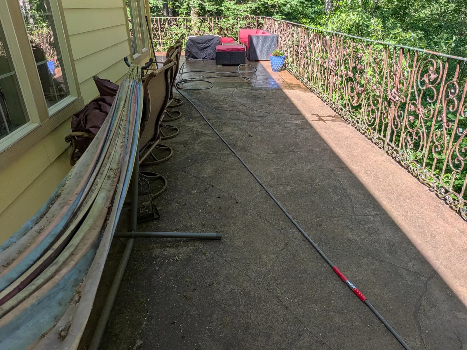Before — Grimy stamped-concrete balcony restored by pressure washing