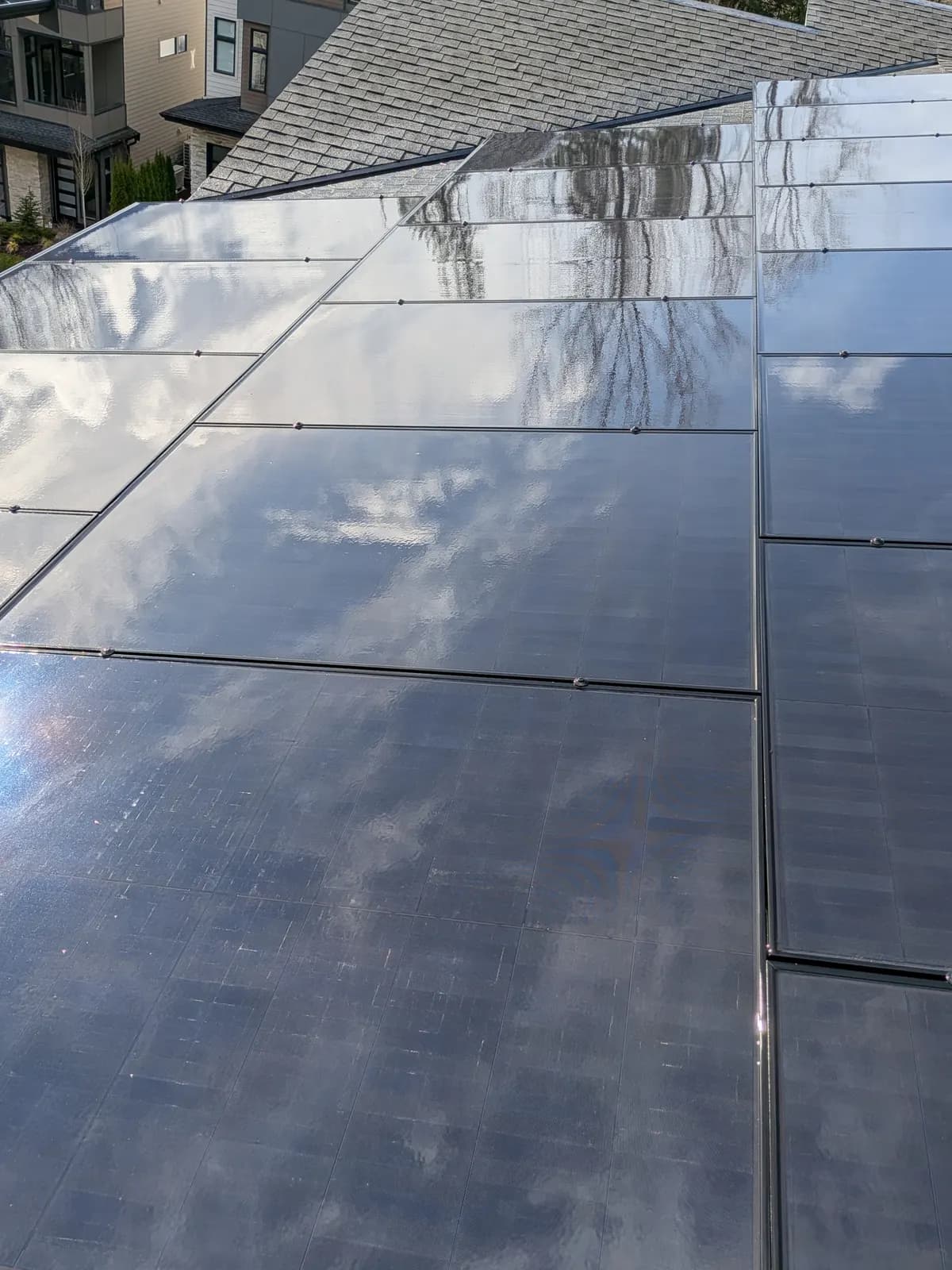 After — Rooftop solar array coated in grime, restored to a clean reflective finish