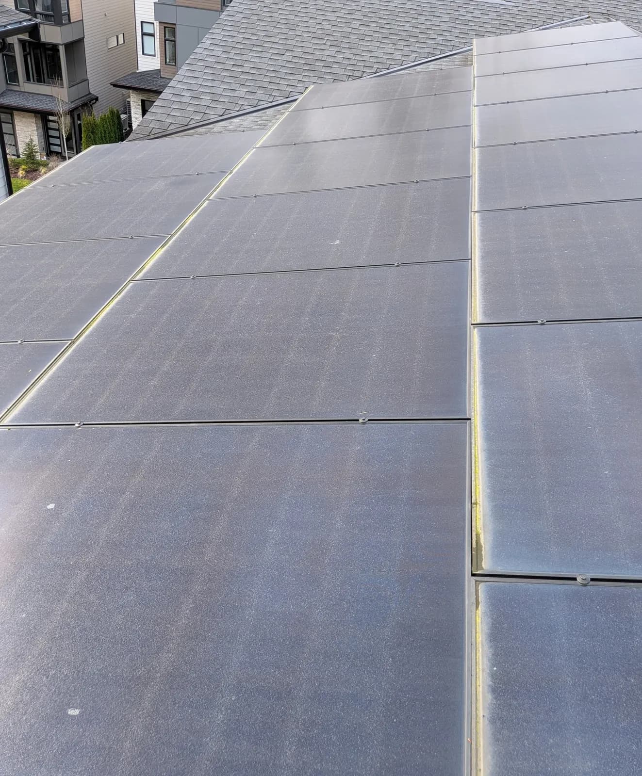 Before — Rooftop solar array coated in grime, restored to a clean reflective finish