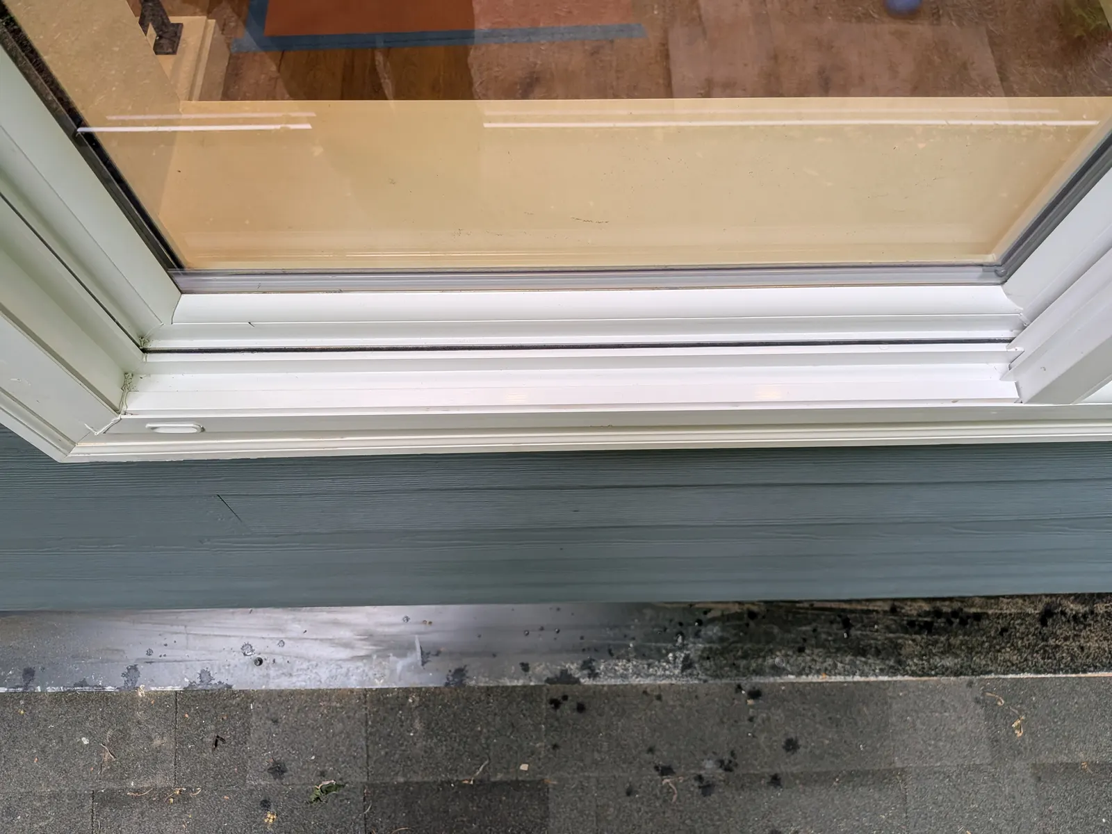 After — Sliding-door track full of sand and debris, detailed to spotless white